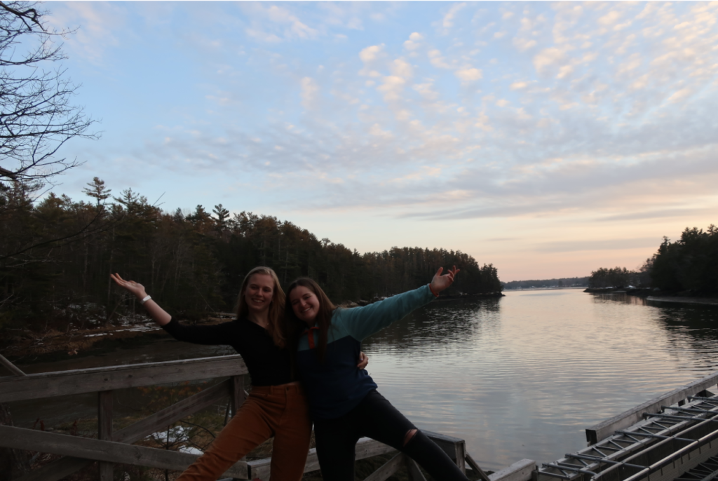 Friends pose for a picture at the waterfront