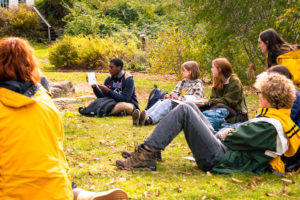 A student share their field journal during an outdoor science class