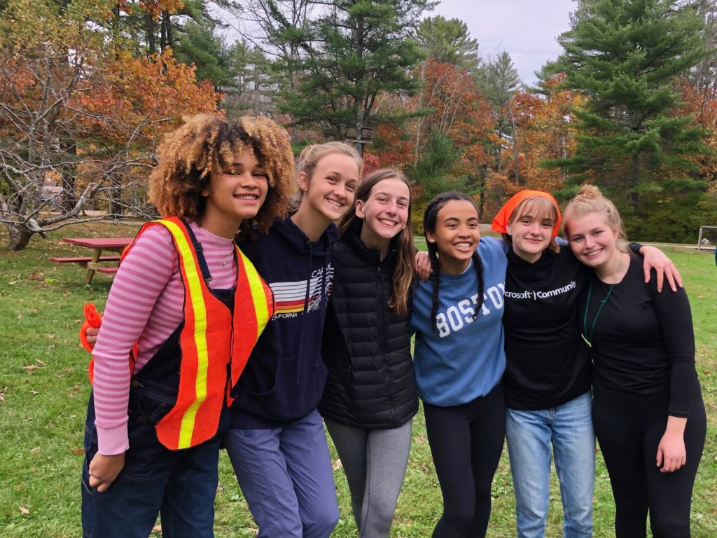 Cabinmates from Orchard Cabin stand together, smiling, before their solos